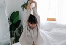 Photo by Anna Pou : Woman stretching on a bed in zen